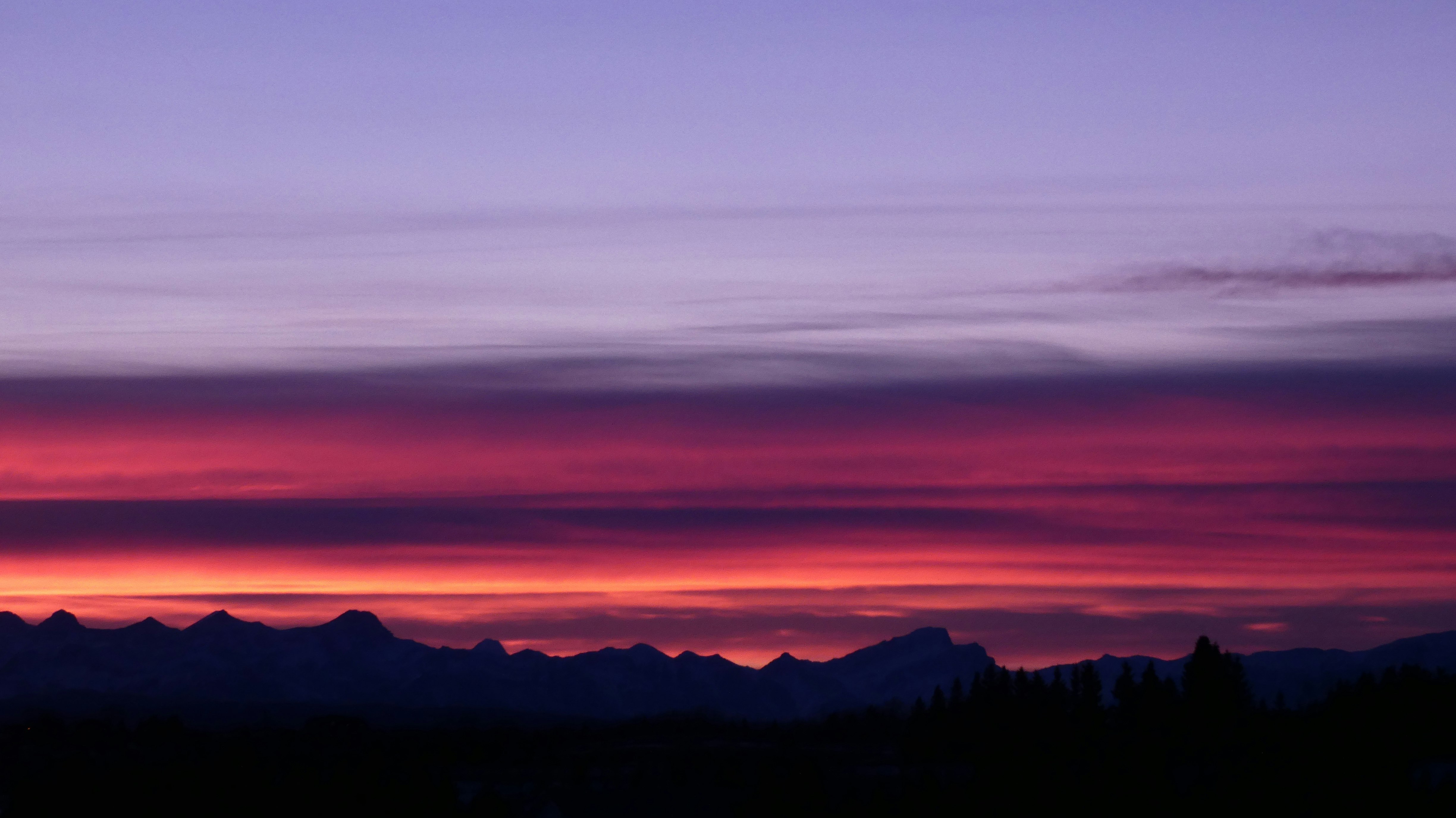 silhouette of mountains during sunset